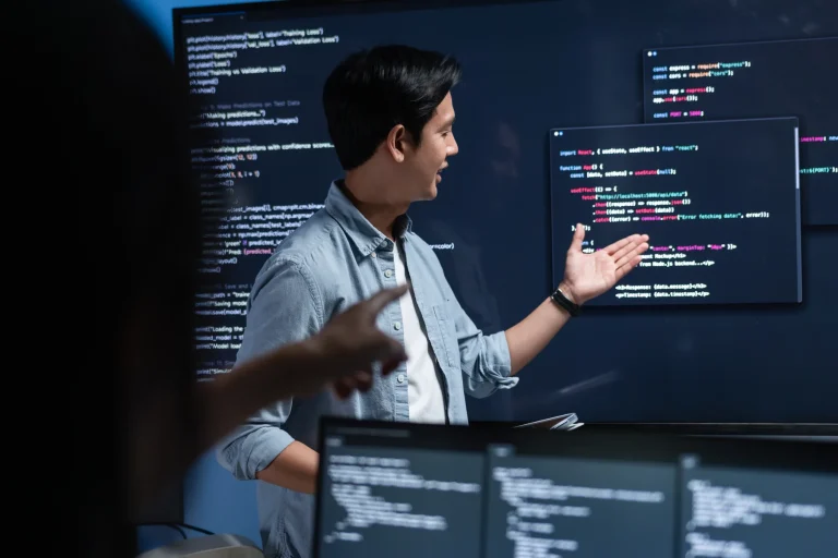 Software engineer explaining code during an AI implementation workshop