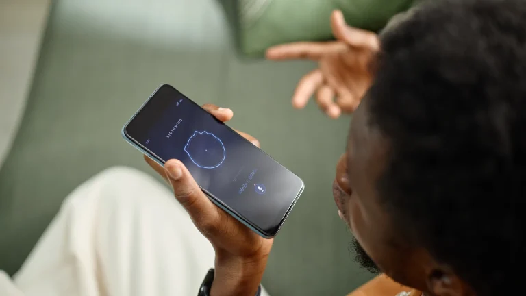 Person holding a smartphone near their face with a circular graphic on the screen