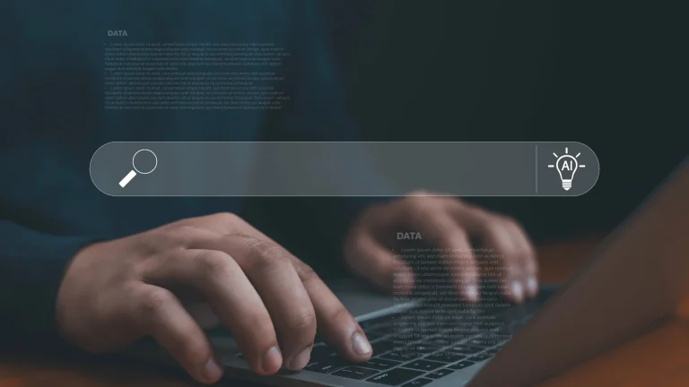 Two hands typing on a laptop keyboard beneath a blank search bar graphic with a magnifying glass icon and a lightbulb icon marked AI